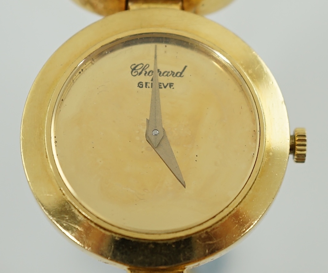 A lady's 18k gold Swiss Chopard manual wind hinged bangle wrist watch